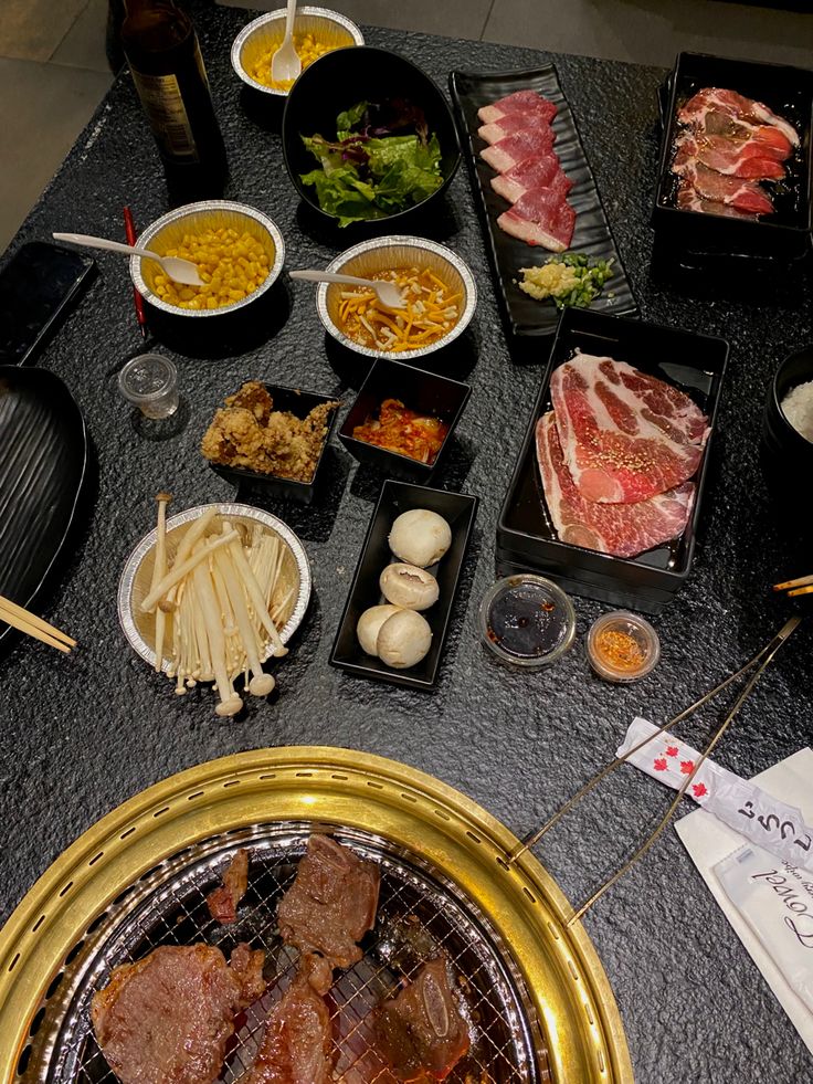 a table topped with lots of different types of food