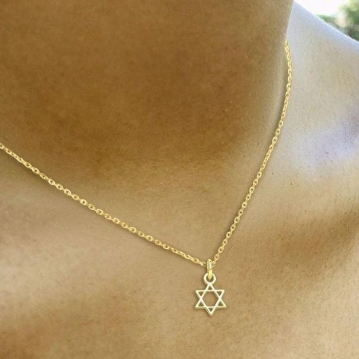 Add some faith and style to your everyday look with our Tiny Jewish Star of David Necklace! This delicate necklace features a tiny Star of David pendant, perfect for showing off your Jewish heritage in a subtle and fashionable way. You'll love adding this unique and meaningful piece to your jewelry collection! * Sterling silver * 1/4" * 16" rolo chain with a 2" adjustable extender Star Of David Jewelry, Character Scenarios, Jewish Fashion, Jewish Star Necklace, Jewish Necklace, Star Of David Necklace, Hand Chain Bracelet, Jewish Heritage, Starburst Necklace