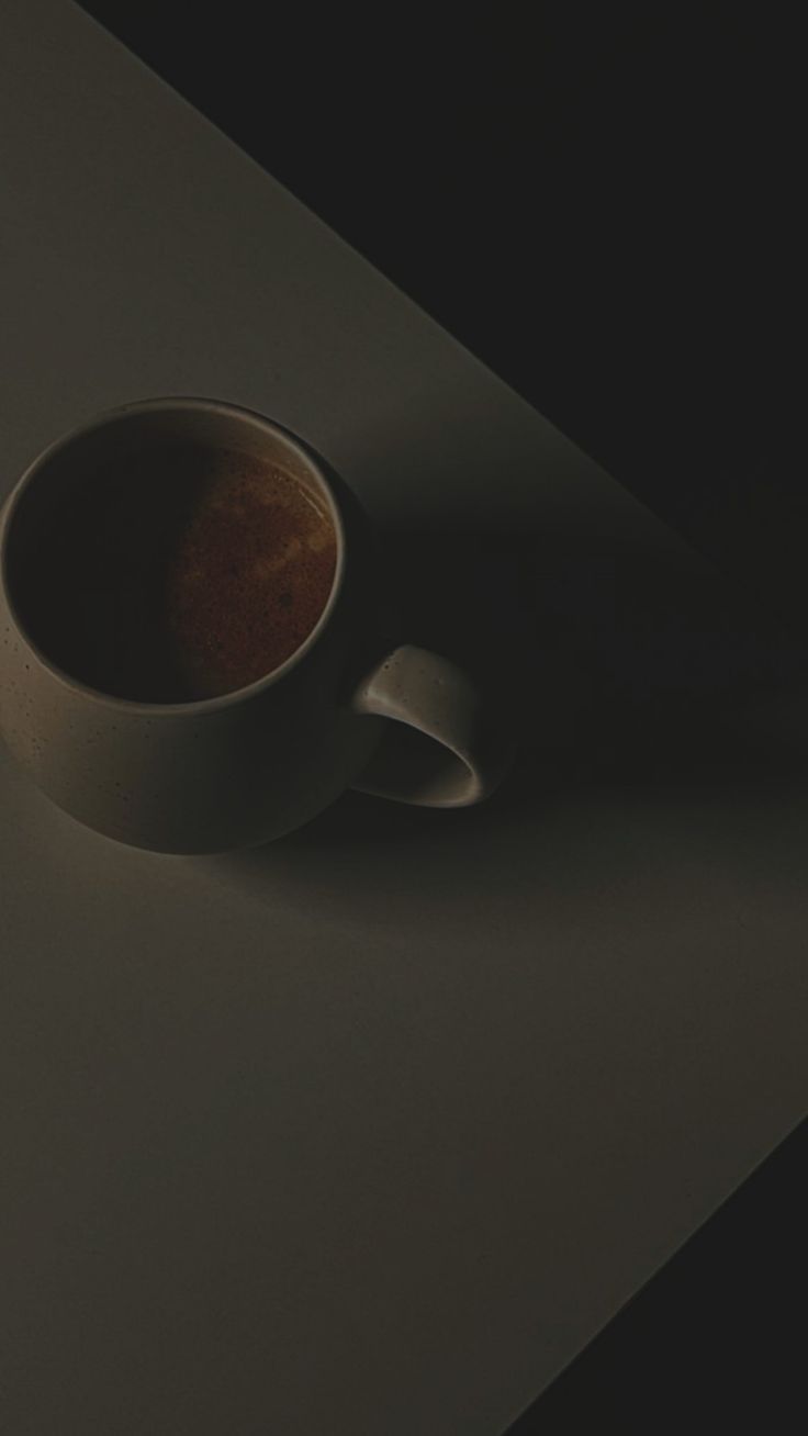 a coffee cup sitting on top of a table