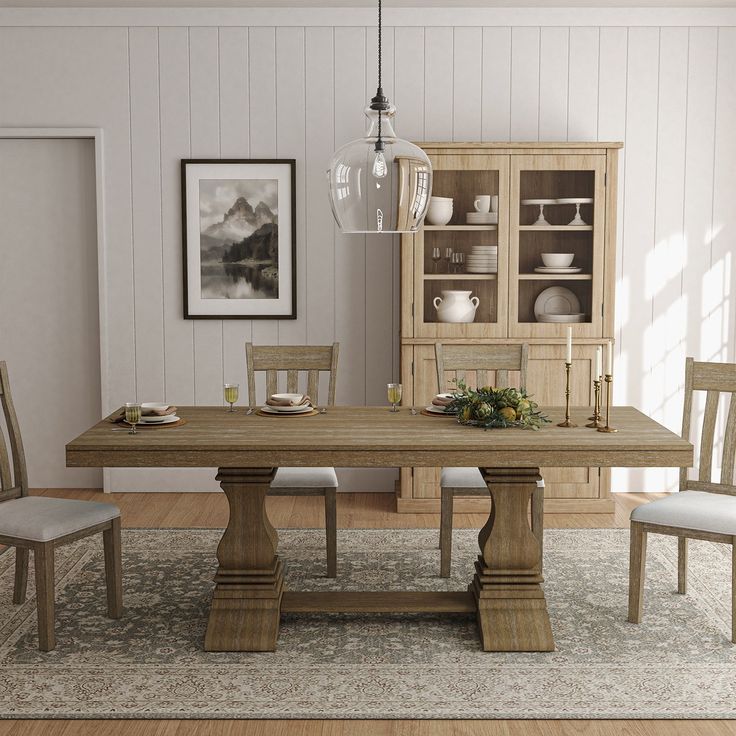 a dining room table and chairs in front of a china cabinet