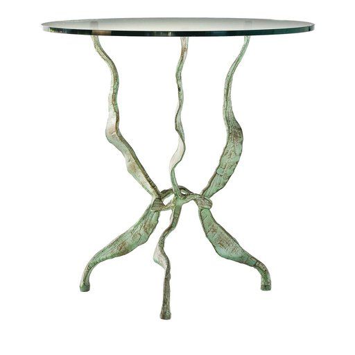 a glass and metal table with an artistic design on the top, against a white background