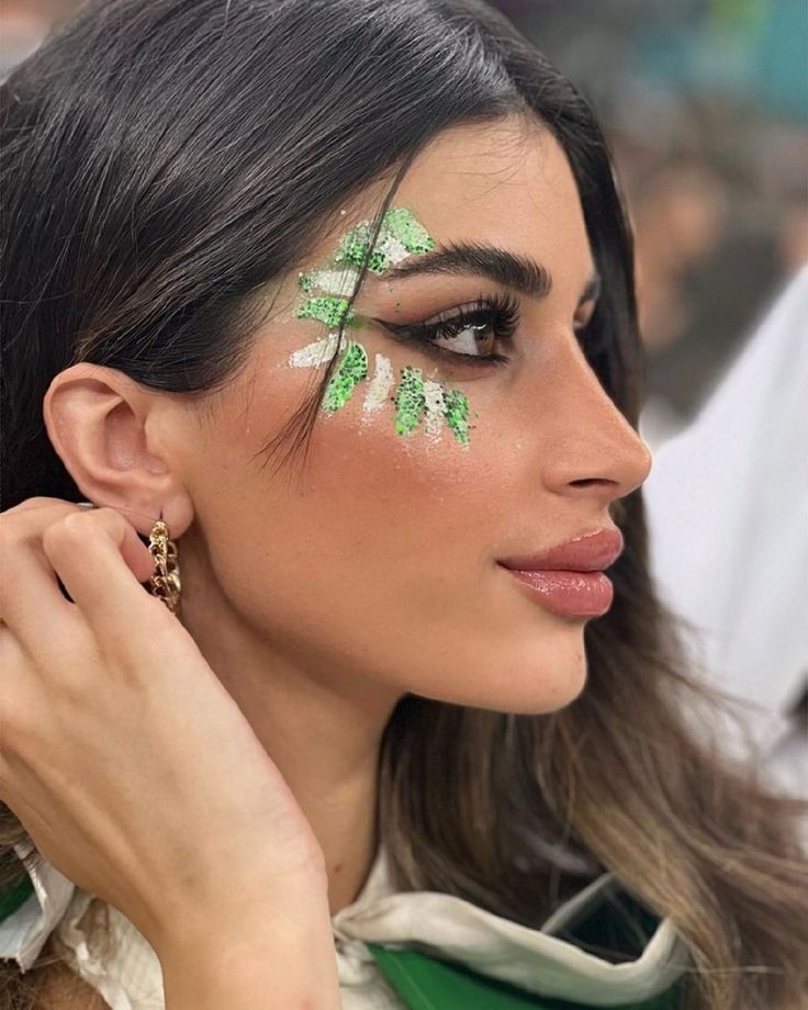 Spirit Day Makeup Homecoming, Dance Face Paint, Green Glitter Makeup Festival, Spirit Face Paint Football, Cheer Glitter Face, Football Makeup Ideas, Pep Rally Face Paint, Football Game Makeup, Color Guard Makeup