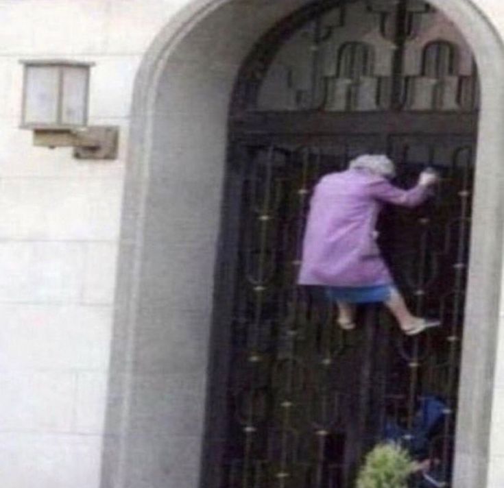 an old woman is jumping into the door