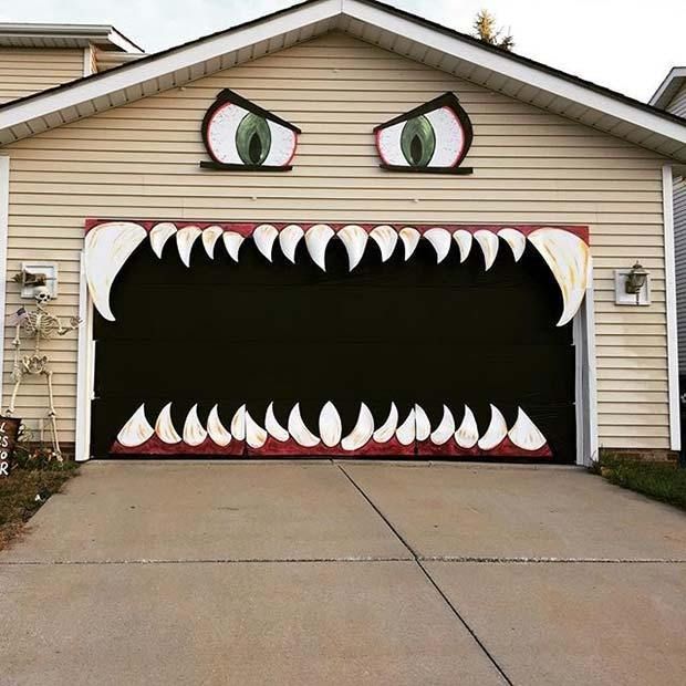 a garage with a large monster's mouth painted on it