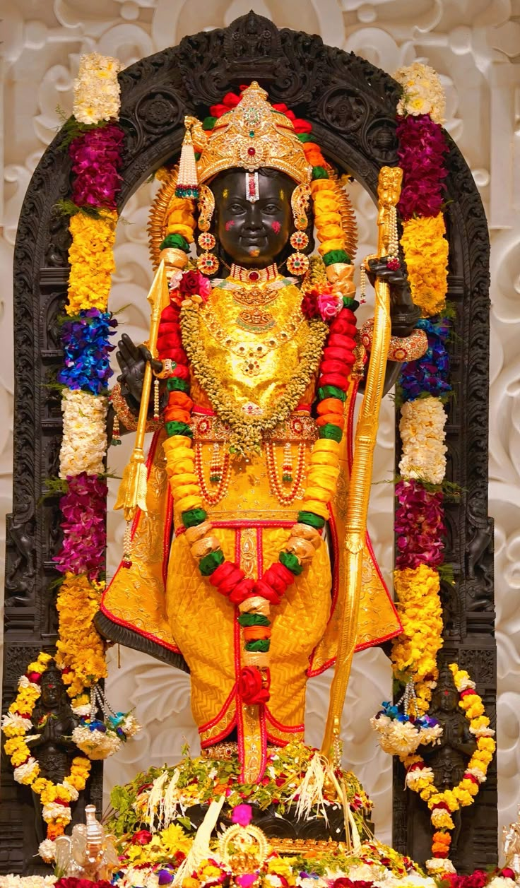 the statue of lord ganesh is surrounded by flowers and garlands