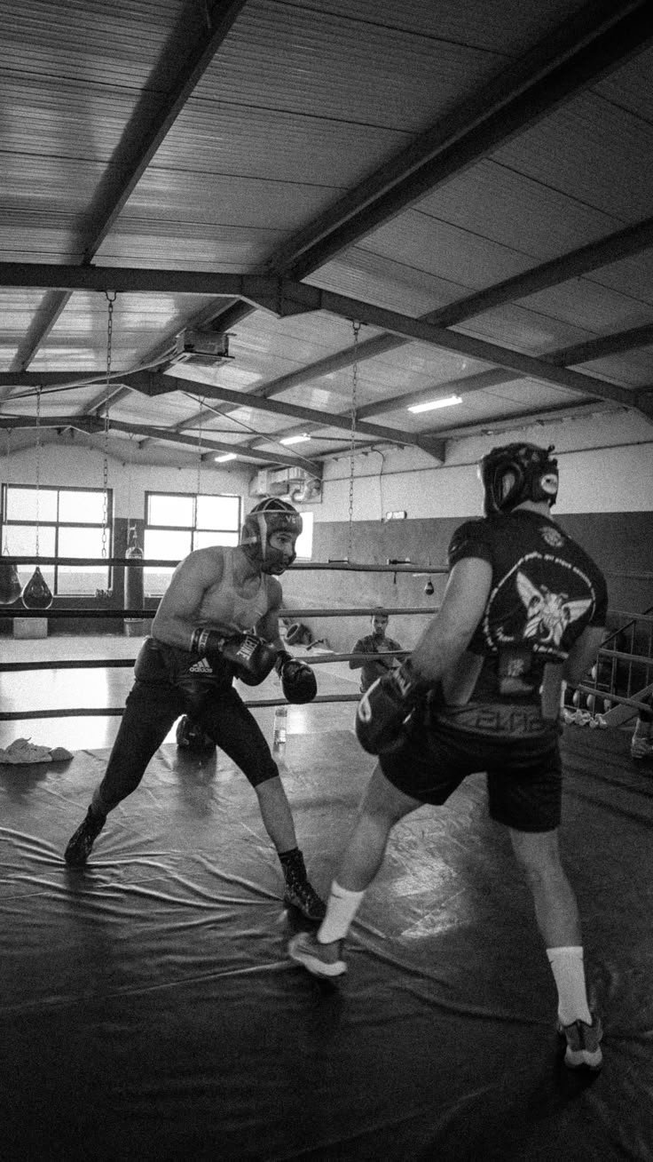 black and white photograph of two men in a boxing ring