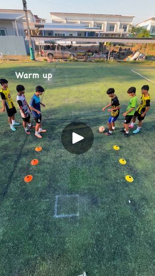 a group of children playing with frisbees on the grass