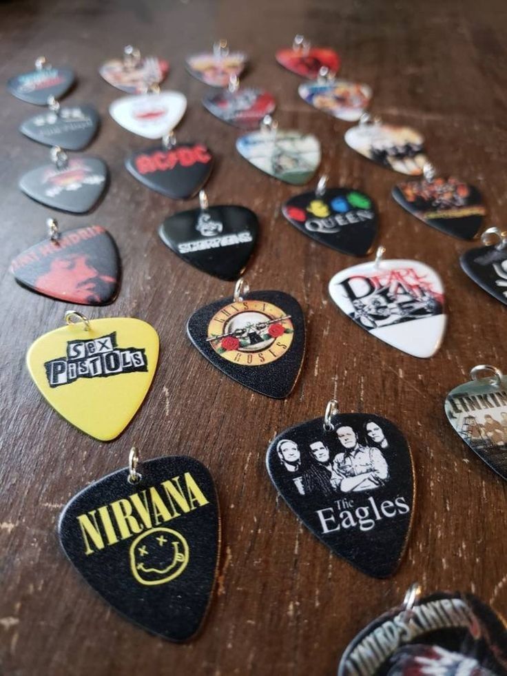 several guitar picks are arranged on a table