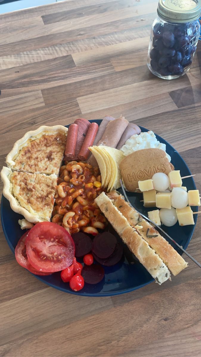 a blue plate topped with different types of food