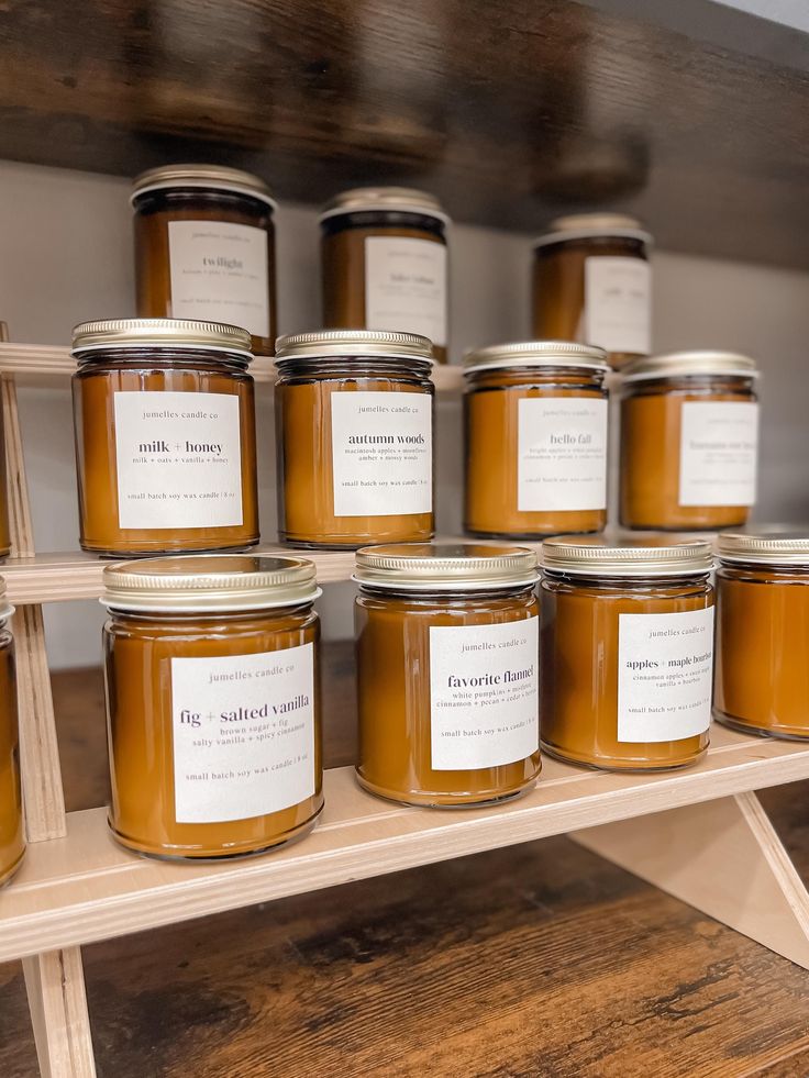 many jars of honey sit on a shelf