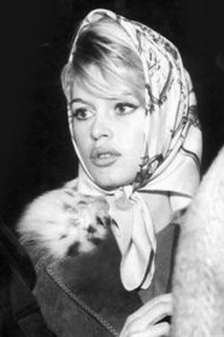 black and white photo of woman with scarf on head