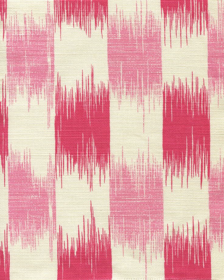 a pink and white fabric with red streaks on it's side, which is very large