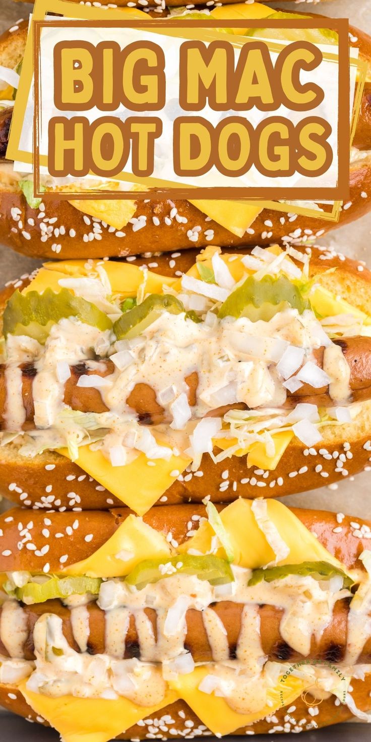 three hot dogs with toppings are stacked on top of each other in buns