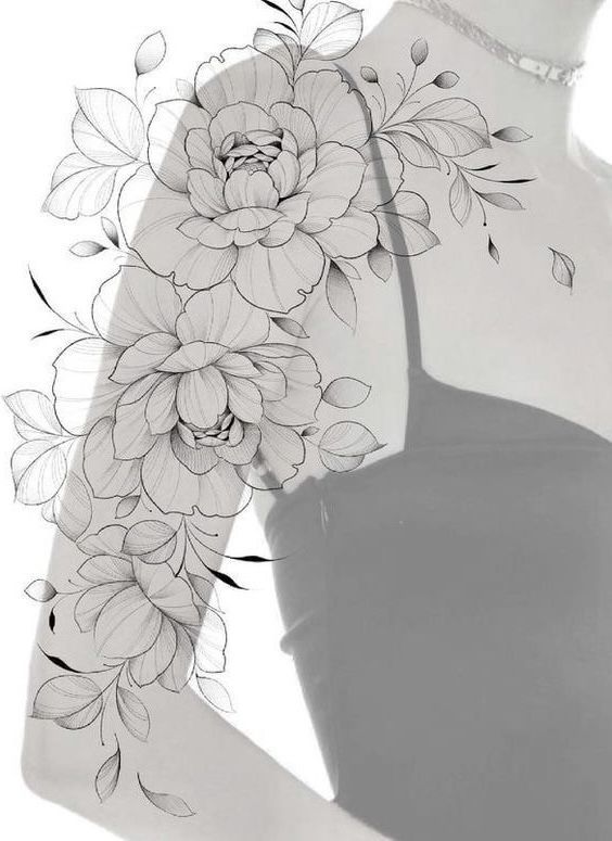 a woman's arm with flowers on it, and the back of her body