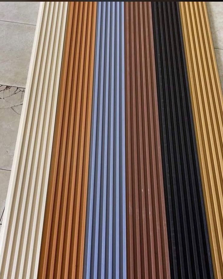 several different colors of metal slats on the floor