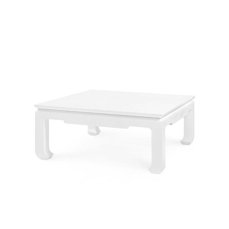 a white coffee table sitting on top of a white floor