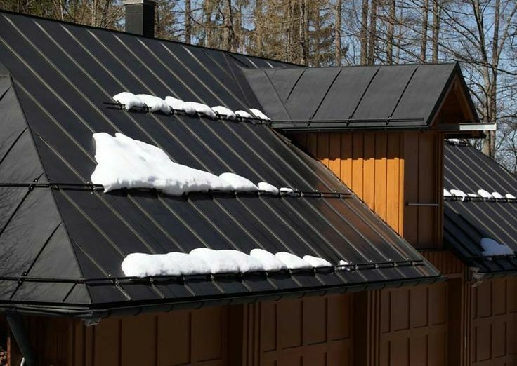 the roof of a house with snow on it