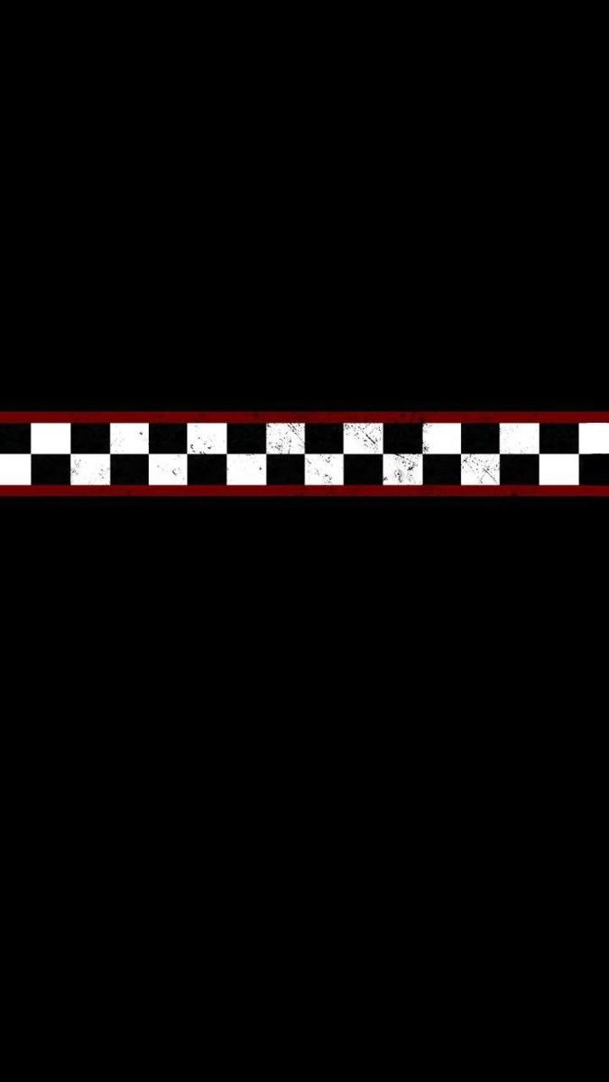 a black and white checkered design with red border