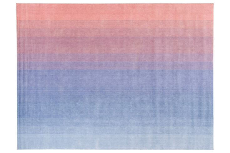 a blue and pink rug with horizontal stripes on the bottom, in shades of purple