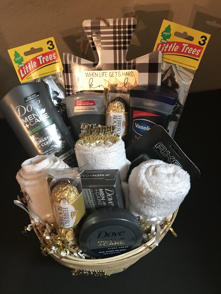 a basket filled with lots of items on top of a black tablecloth covered floor