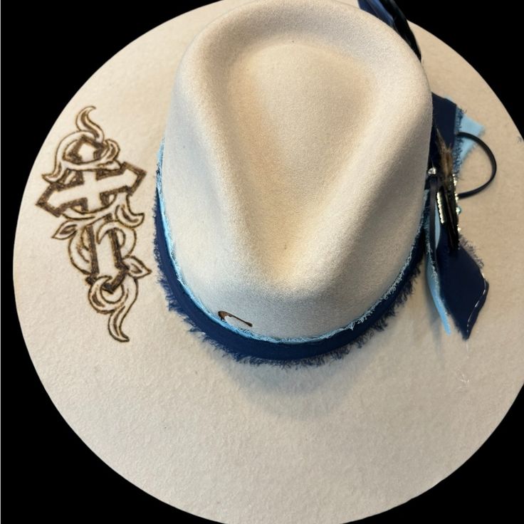 Hand Burned Cross/Scroll On Brim. Two Toned Blue Chiffon Ribbon Band And Custom Removable Feather Embellishment. Size Medium. Custom Charlie One Horse Hats, Charlie Horse Hats, Charlie Horse, Hand Burn, Women Accessories, Cream, Band, Hats, Blue