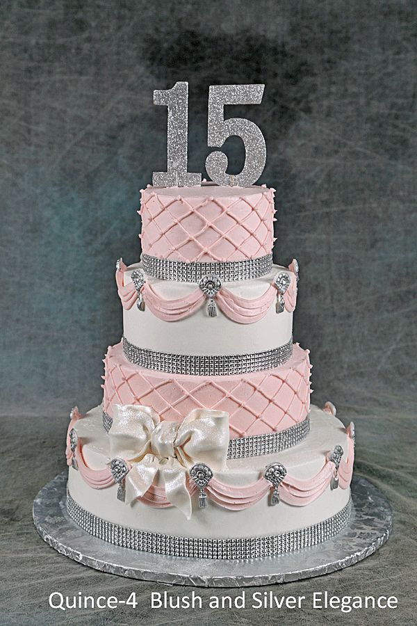 a three tiered cake with pink and silver decorations