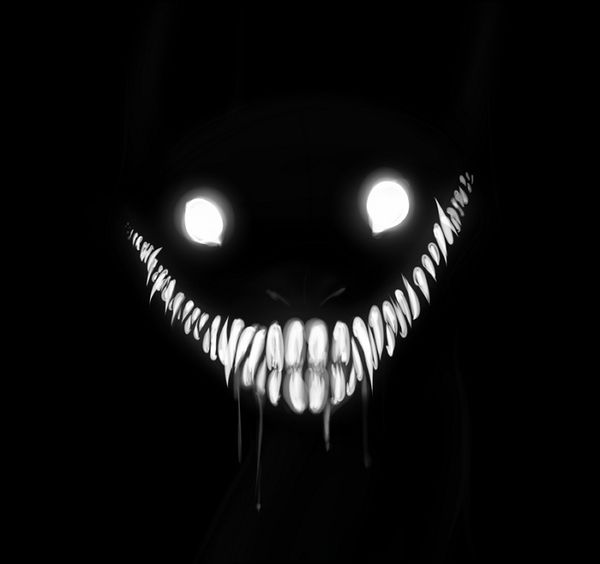 a creepy face with glowing eyes in the dark