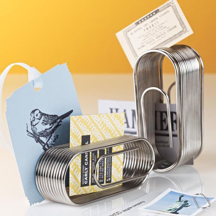 an assortment of tin cans and tags on a table