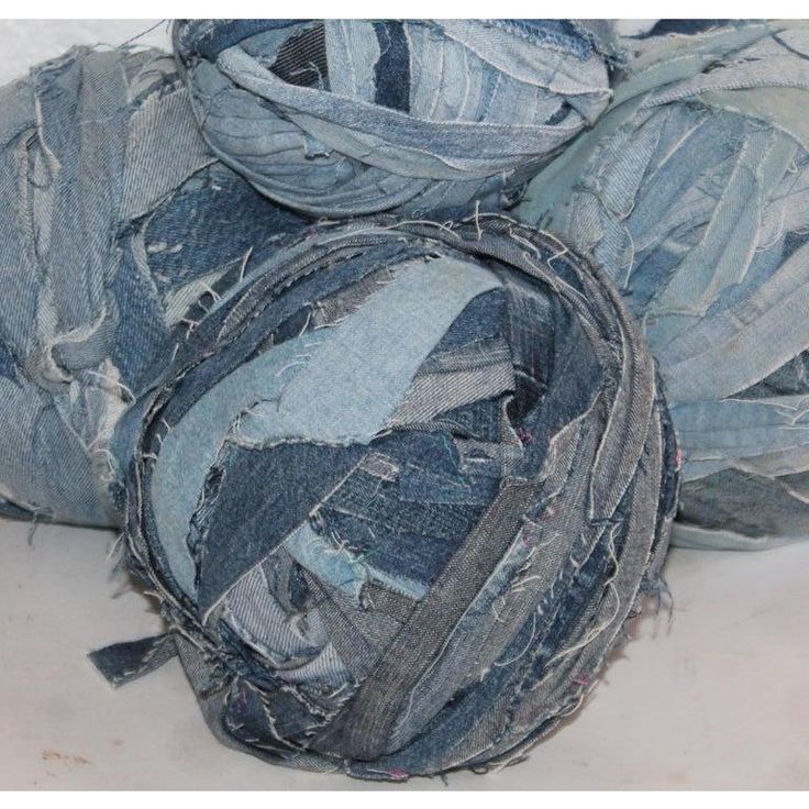 several pieces of blue jean fabric sitting on top of each other