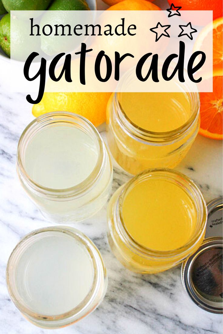 homemade gatorade recipe with oranges and limes in mason jars on a marble countertop