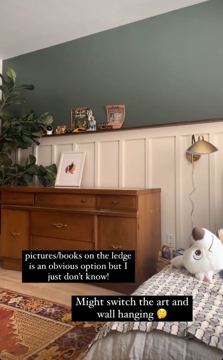 a bed room with a neatly made bed and a stuffed animal on top of it