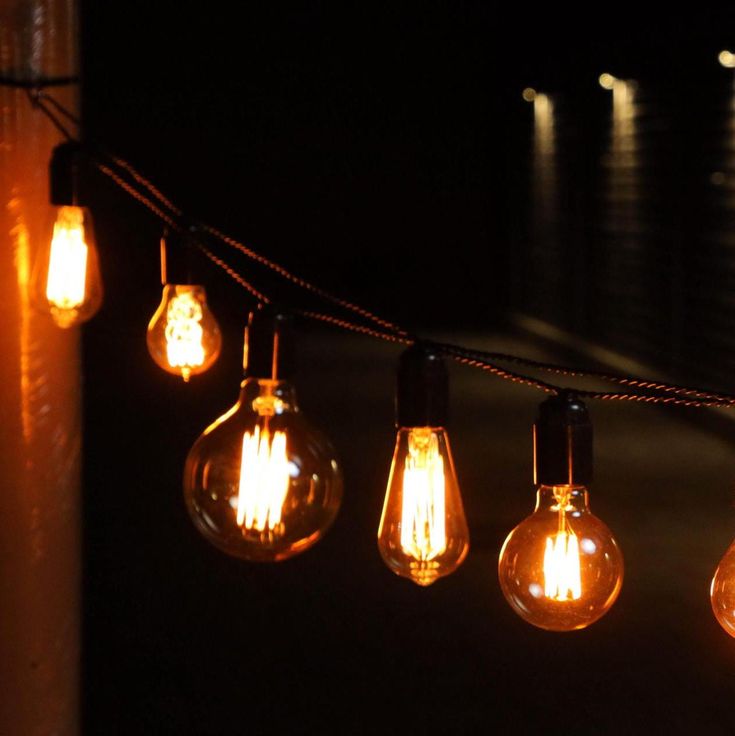 some light bulbs are hanging on a string