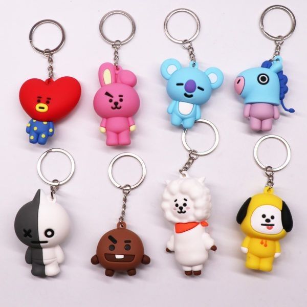 six different key chains with cartoon characters on them, all in various colors and shapes