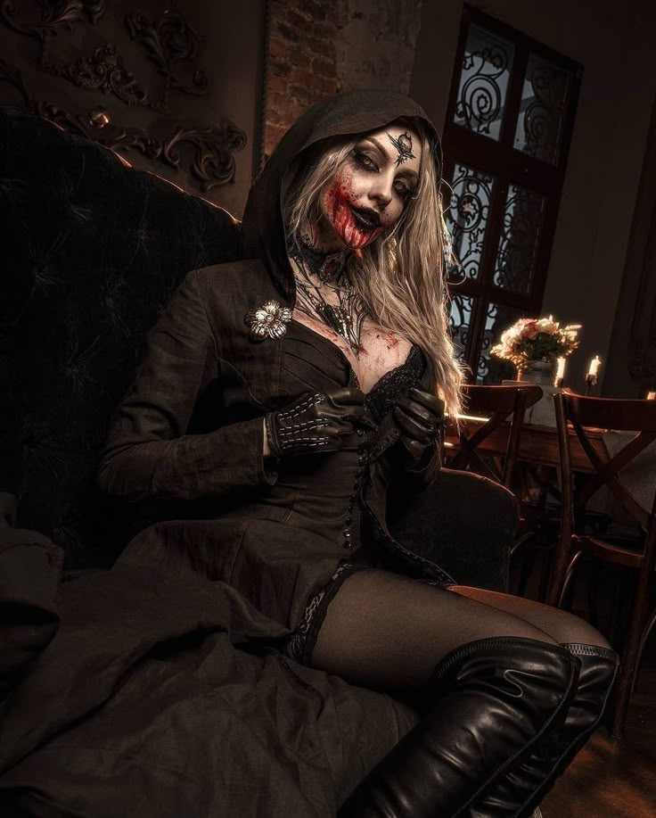 a woman dressed as a zombie sitting on a couch