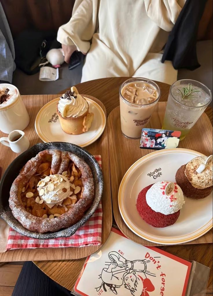 several desserts and drinks are on the table