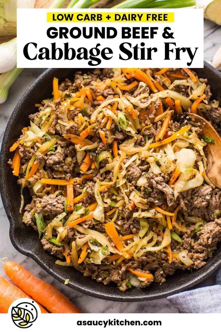 ground beef and cabbage stir fry in a skillet with carrots on the side