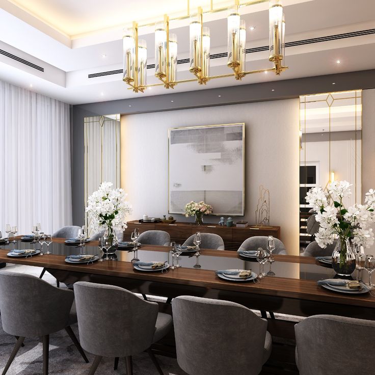 a dining room table is set with place settings and flowers in vases on the tables