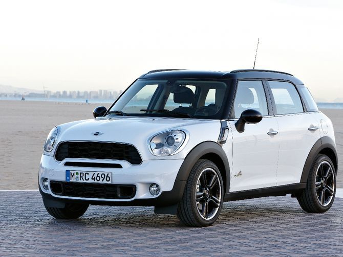 a white mini countryman parked on the beach