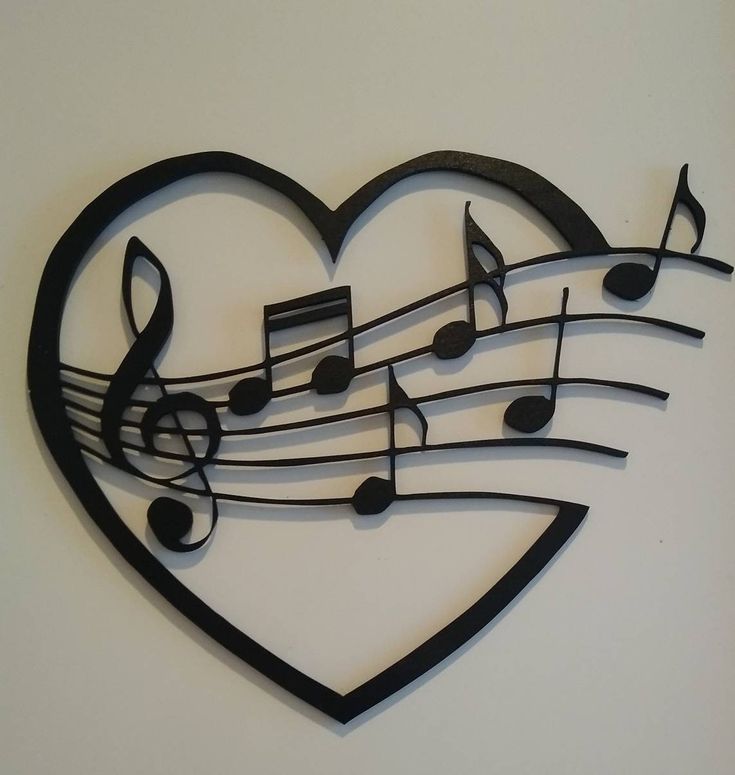 a metal heart with musical notes on it