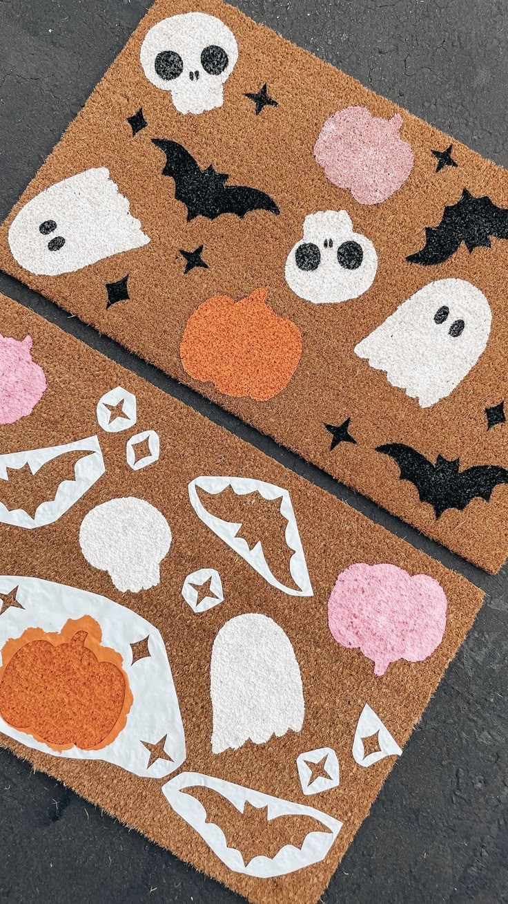 two halloween door mats on the ground