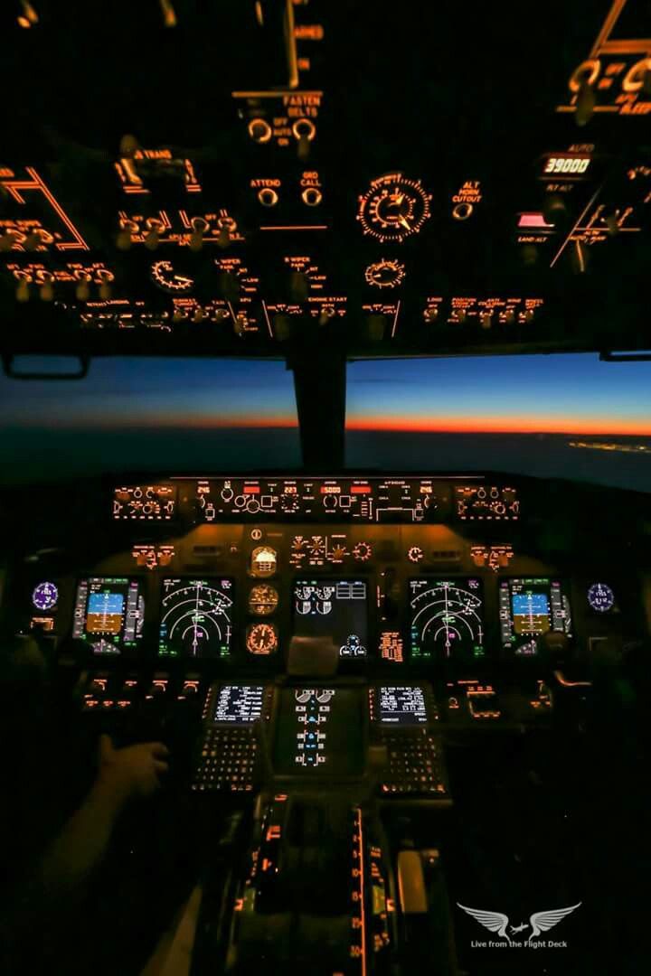 the view from inside an airplane at night with illuminated cockpits and instruments on display