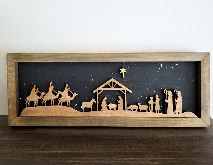 a wooden nativity scene with the birth of jesus