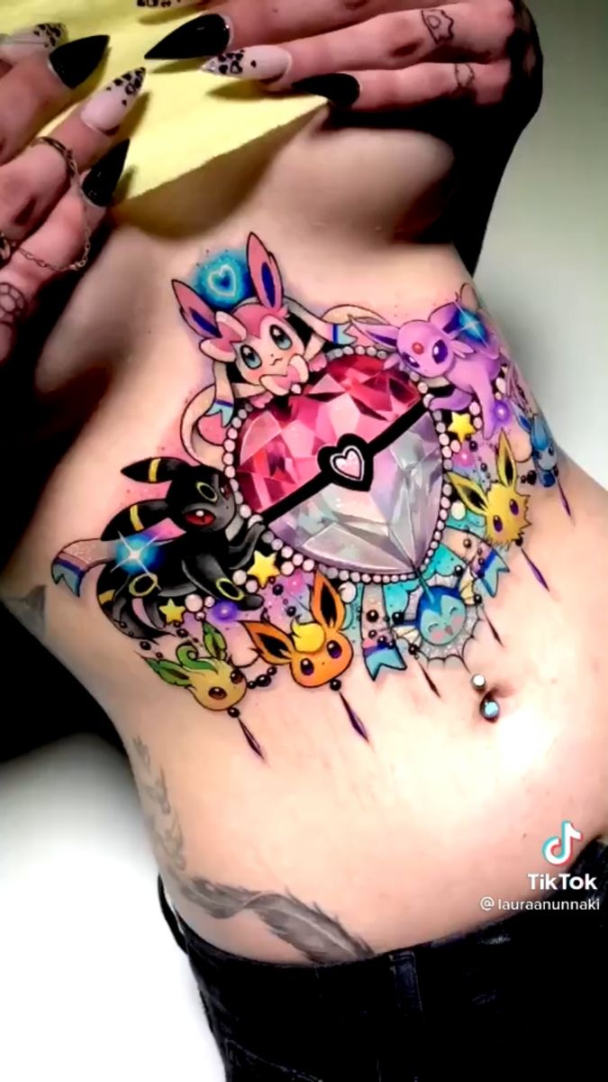 a woman with tattoos on her stomach has a clock in the shape of a cat