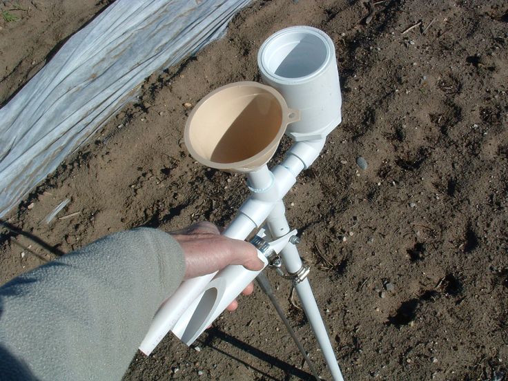 a person is holding a white object in their hand and it's attached to a pole