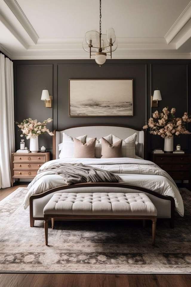 a large bed sitting in a bedroom on top of a wooden floor next to a window