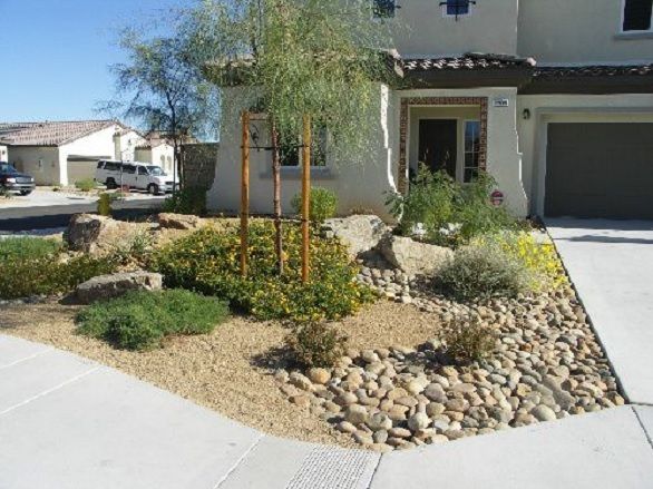 a house with landscaping in front of it