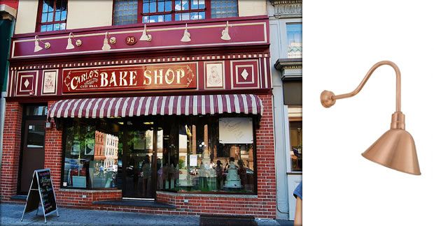 the front of a bakery shop with red awnings on it's windows