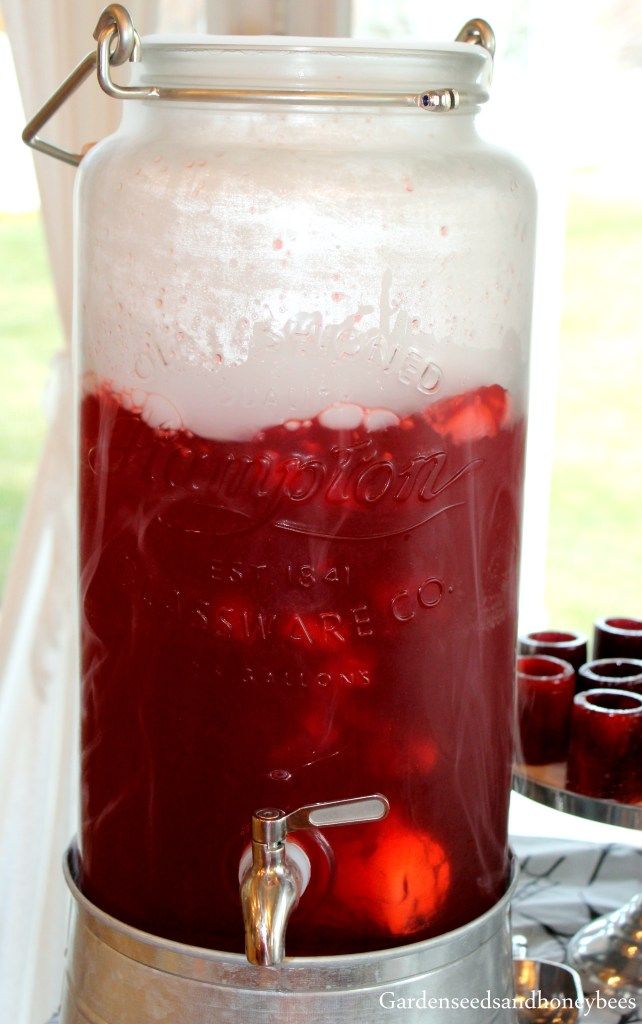 a large jar filled with liquid sitting on top of a stove