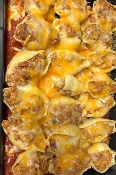 a casserole dish filled with meat and cheese