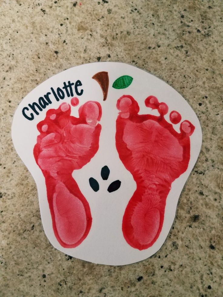 a hand and foot imprint on a paper plate with the words charlotte written in it